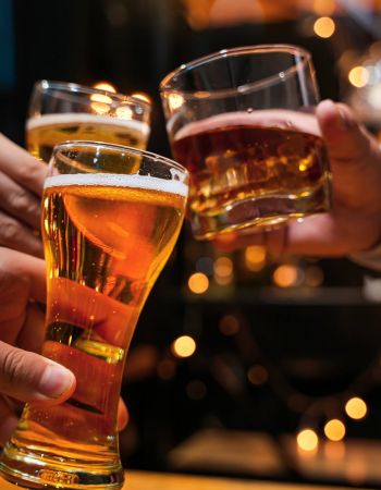 Friends clinking beers