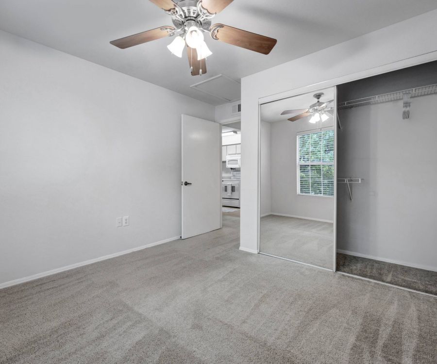 La Calera spacious bedroom with carpet, ceiling fan, and large closet